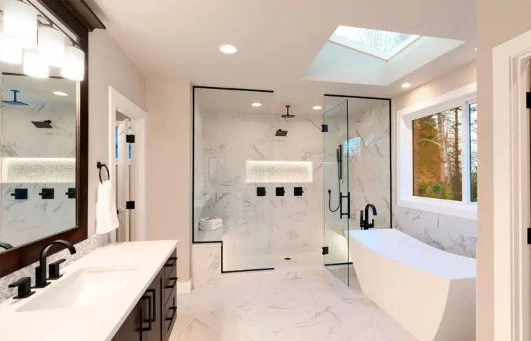 Primary bathroom remodel with double vanity, skylight and freestanding tub