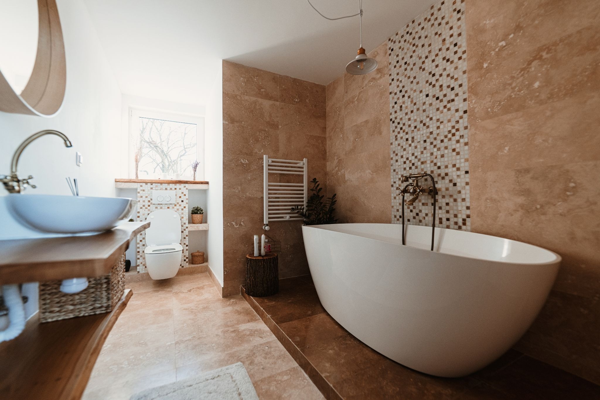 Remodeled bathroom with freestanding soaking tub
