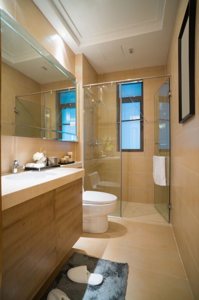 Full bathroom remodel with frameless glass shower and tiled walls