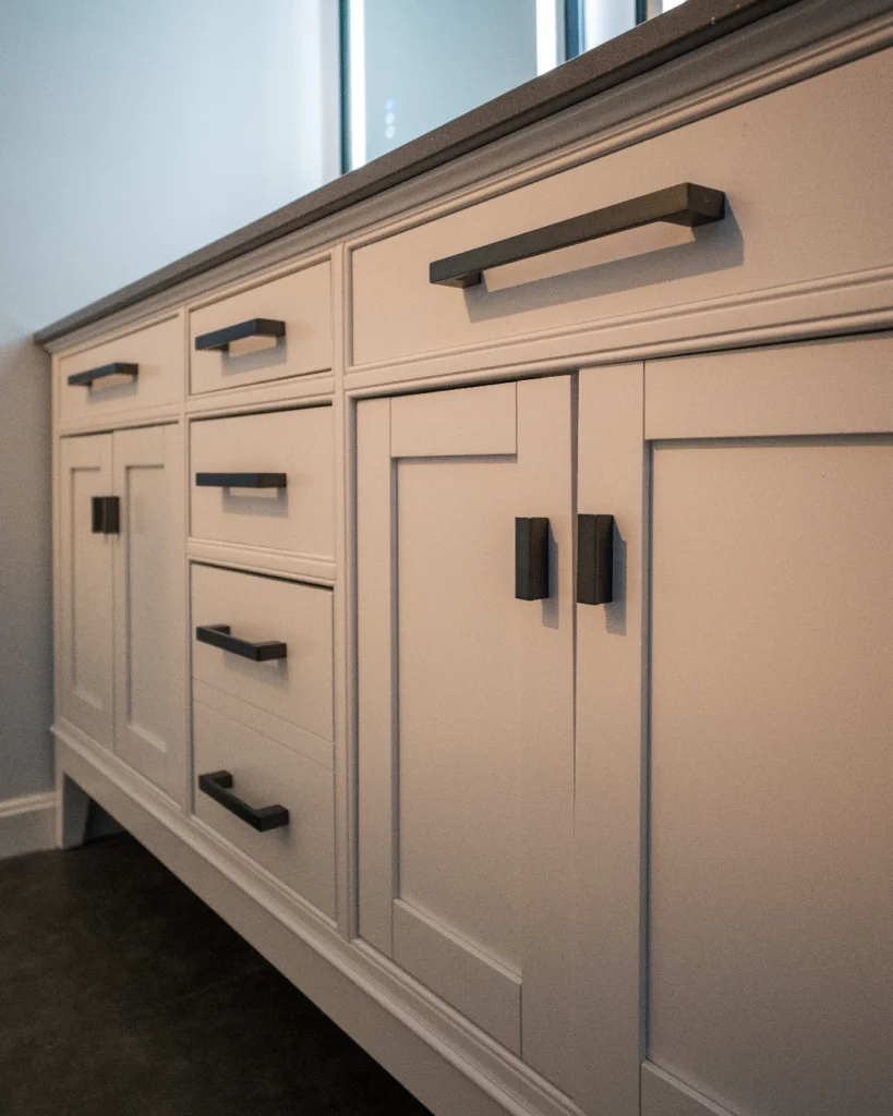 White shaker vanity with black hardware